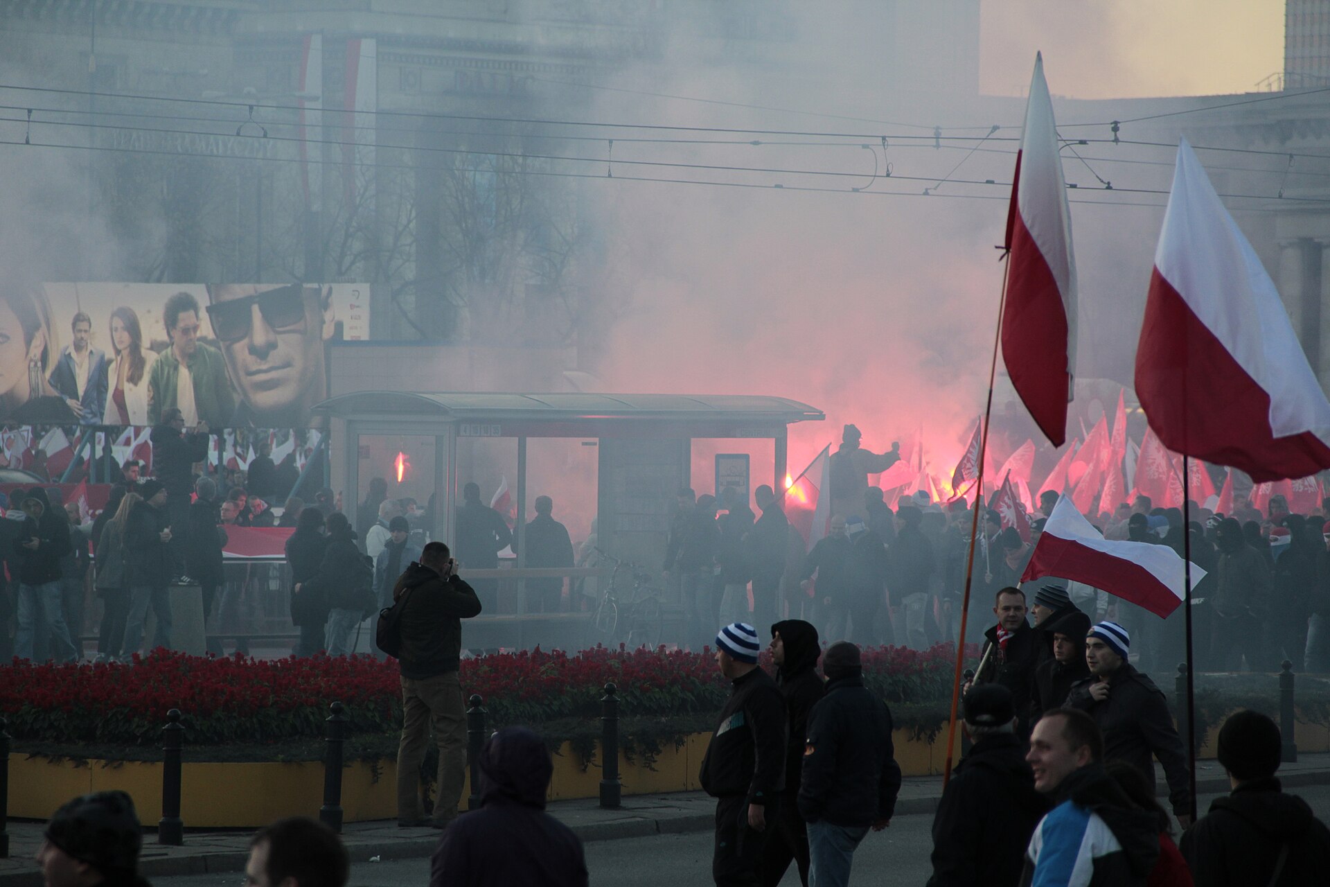 A crowd carrying Polish flags on Independence Day in Warsaw