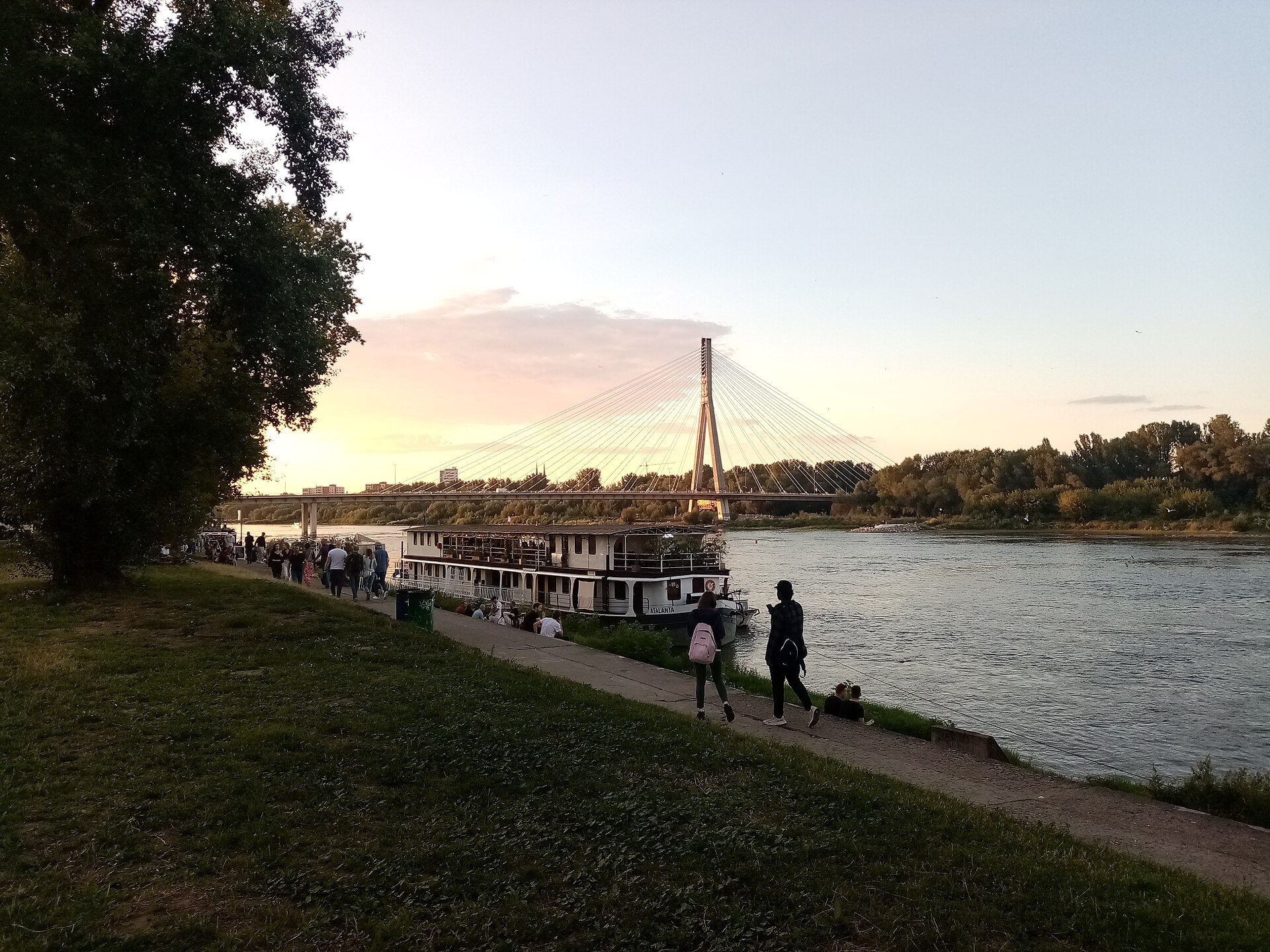People walking along the Vistula Boulevards in Warsaw